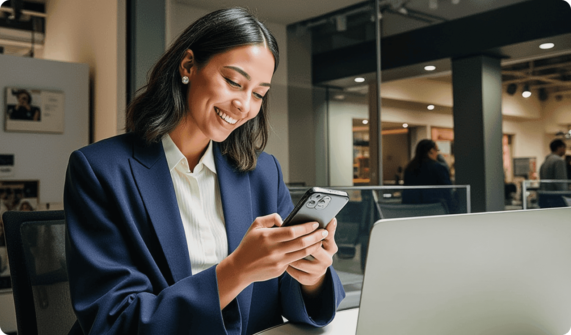 Smiling woman on video call in modern office with representing an in-house migration team.