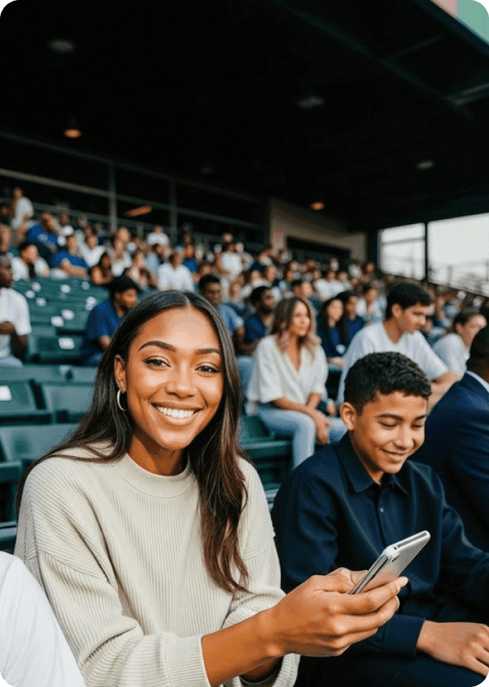 Entertainment fan laughing at her phone outdoors
