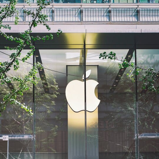Image of the front of an Apple store with the Apple logo in the center.