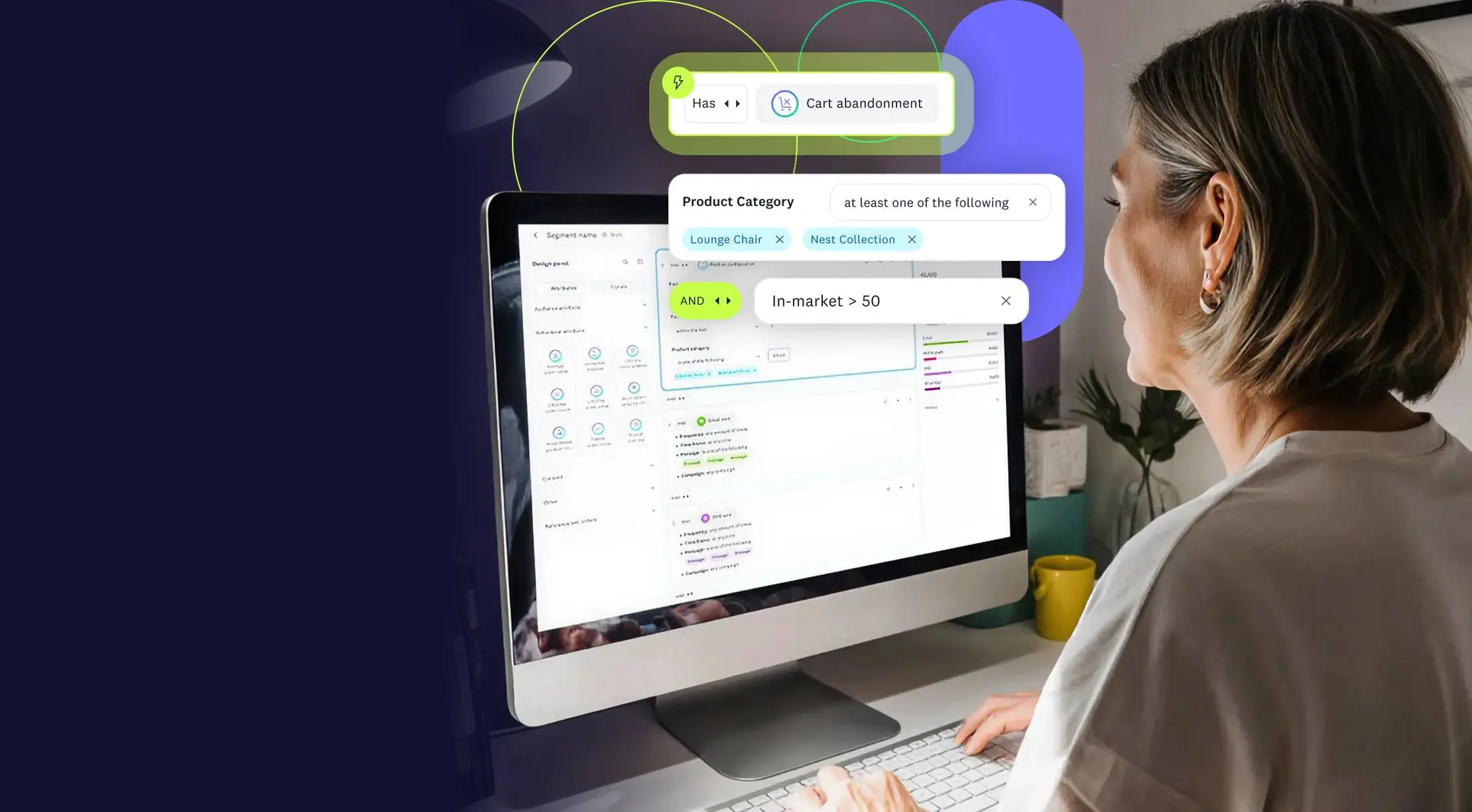 A person viewing the Acoustic segment-builder UI on a desktop monitor, showing cart abandonment and in-market interest rule conditions.