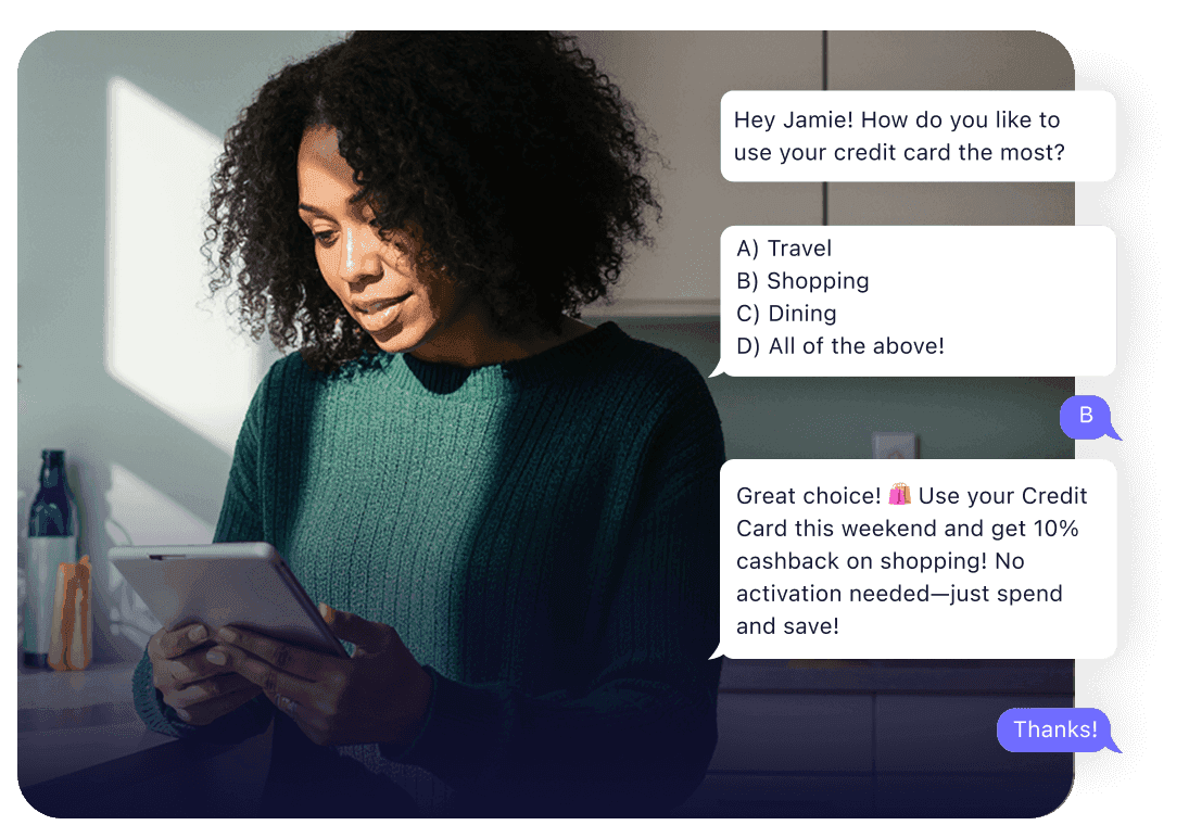 Woman at a laptop beside a two-way SMS conversation about a credit-card offer